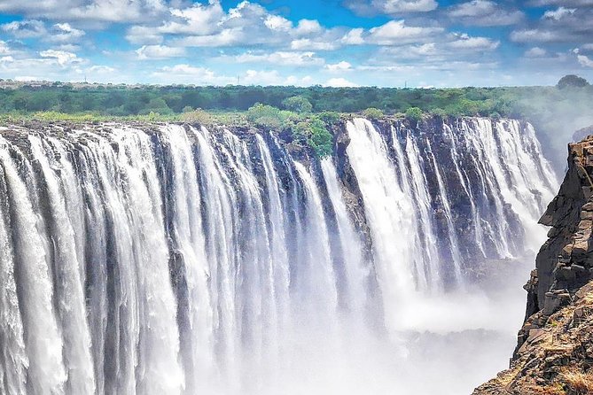 7 Day Highlights Of Botswana Overland Tour – ACCOMODATED (midrange) - Victoria Falls rainforest walk at Mosi-oa-Tunya, with park-fee reality