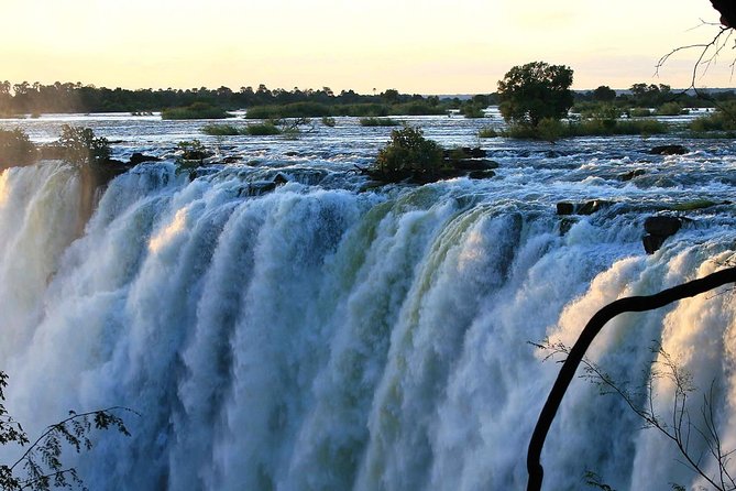 Victoria Falls Guided Tour with Hotel Pickup - Hotel pickup and air-conditioned comfort before the first view