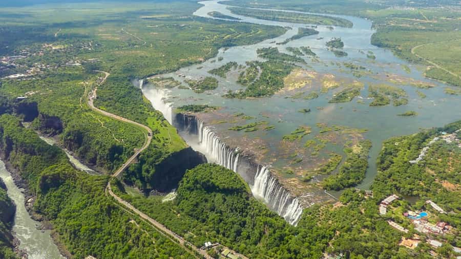 Victoria Falls: Helicopter Flight Aerial View of The Falls - Getting picked up near town, and what that means for timing