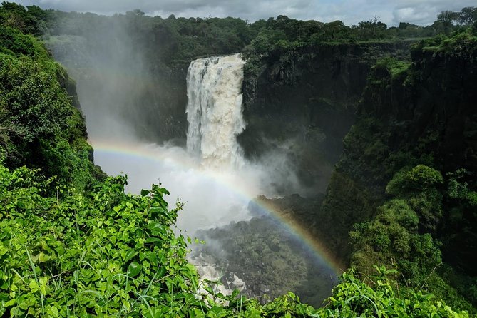 Victoria Falls Private Guided Sunrise Tour - Stop 1, Victoria Falls at sunrise: rainbows, spray, and walking viewpoints